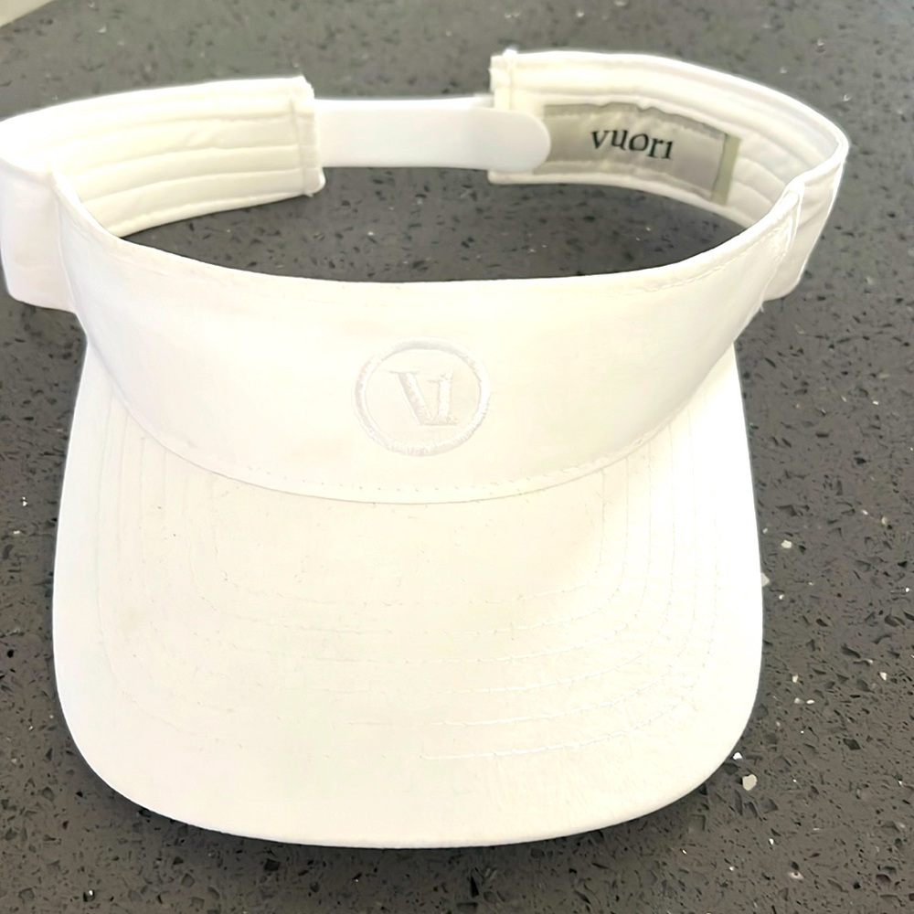 Women’s white Vuori visor with adjustable strap.